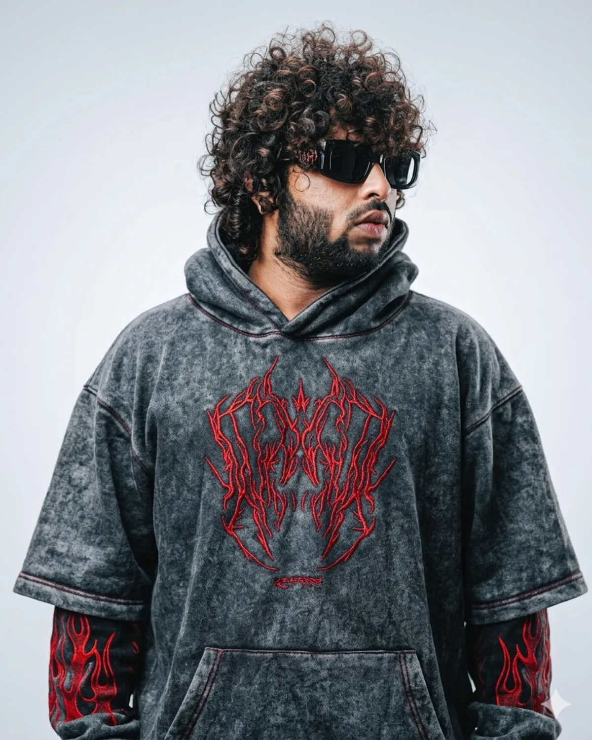 Approved Pyrokine editorial portrait in a dark hoodie