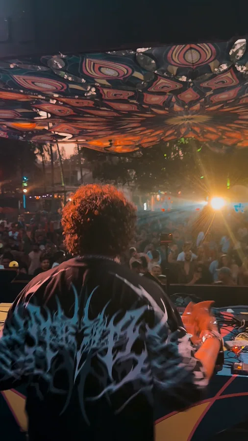 Pyrokine facing the dance floor during a night performance